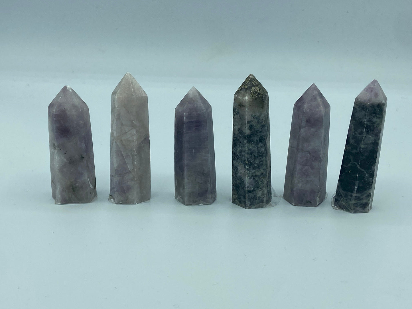 Kunzite towers with tourmaline and pyrite inclusions. Pick your favourite crystals. Metaphysical, love, romance, stone