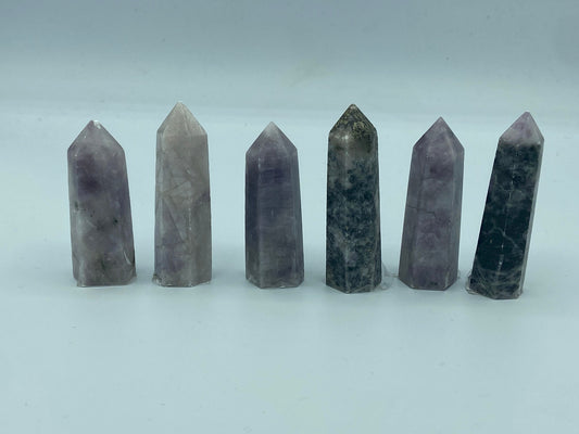 Kunzite towers with tourmaline and pyrite inclusions. Pick your favourite crystals. Metaphysical, love, romance, stone