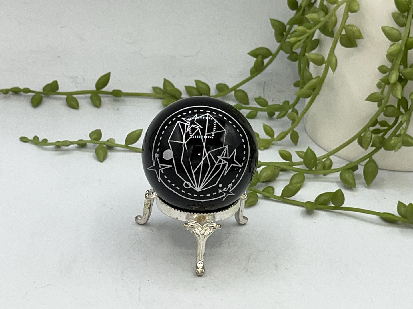 Black Obsidian Sphere with a crystal cluster & star design engraved in silver. Crystal Spheres, home decor, Obsidian Sphere, Birthday Gift