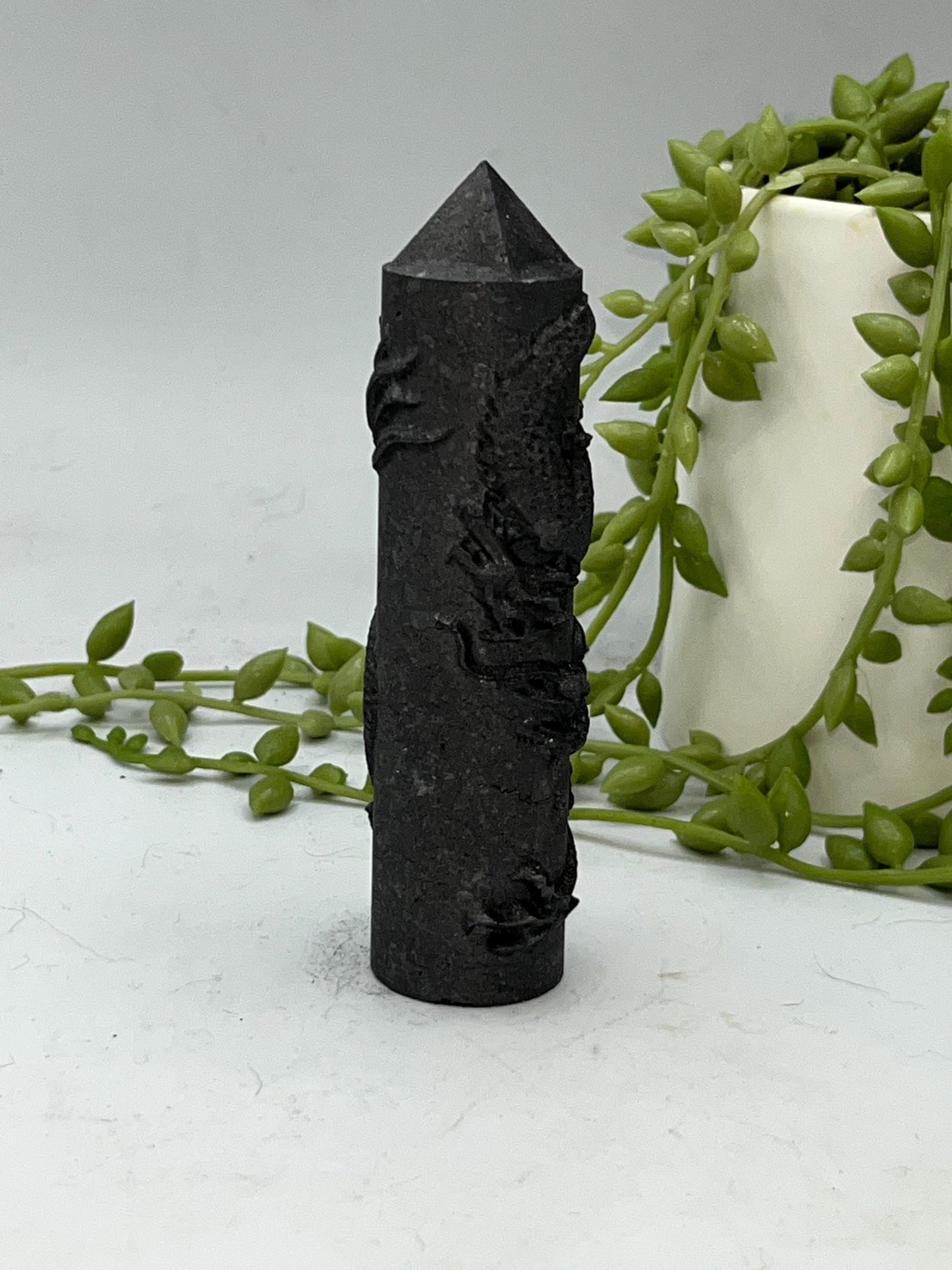 Shungite Chinese style Dragon round tower with pyramid tip.
