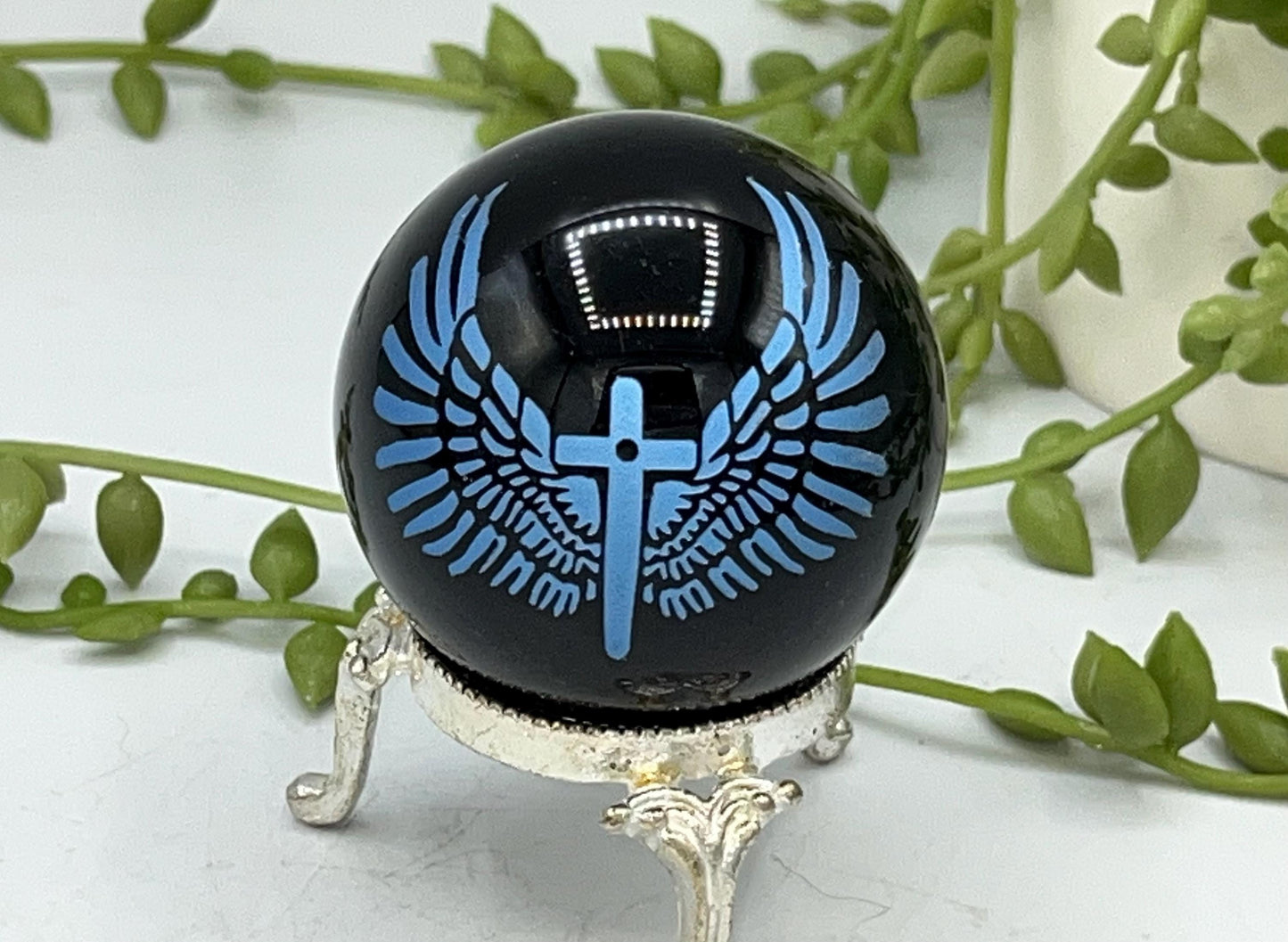 Black obsidian sphere with blue angel wings and crucifix engraving. crystal spheres, home decor, crystal healing, black Obsidian crystals