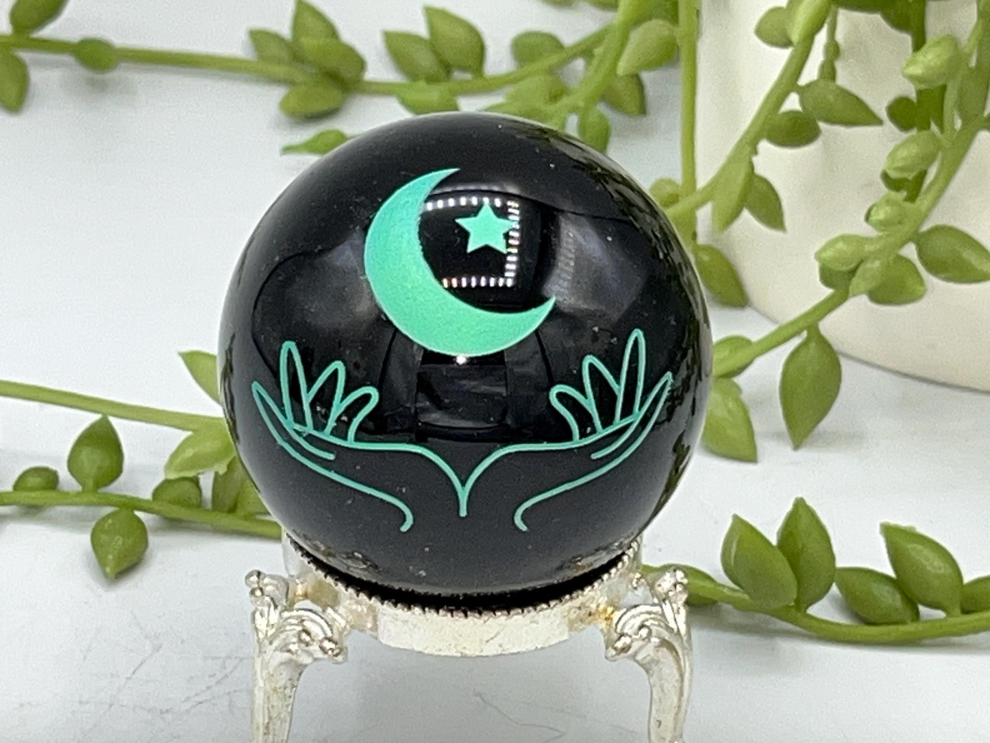 Black obsidian sphere with moon and hands engraved in mint green. crystal spheres, home decor, crystal healing, black Obsidian crystal, gift