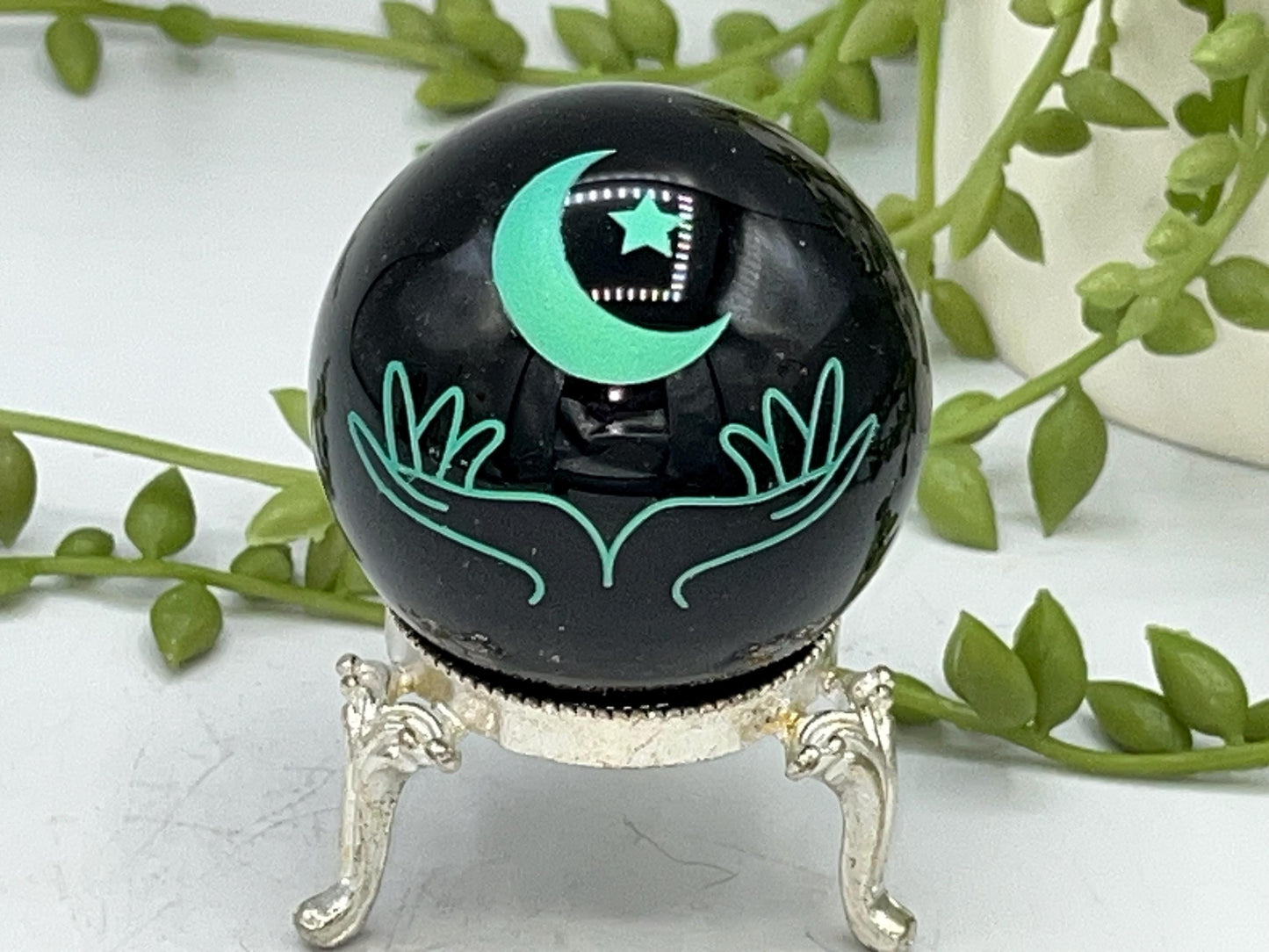 Black obsidian sphere with moon and hands engraved in mint green. crystal spheres, home decor, crystal healing, black Obsidian crystal, gift