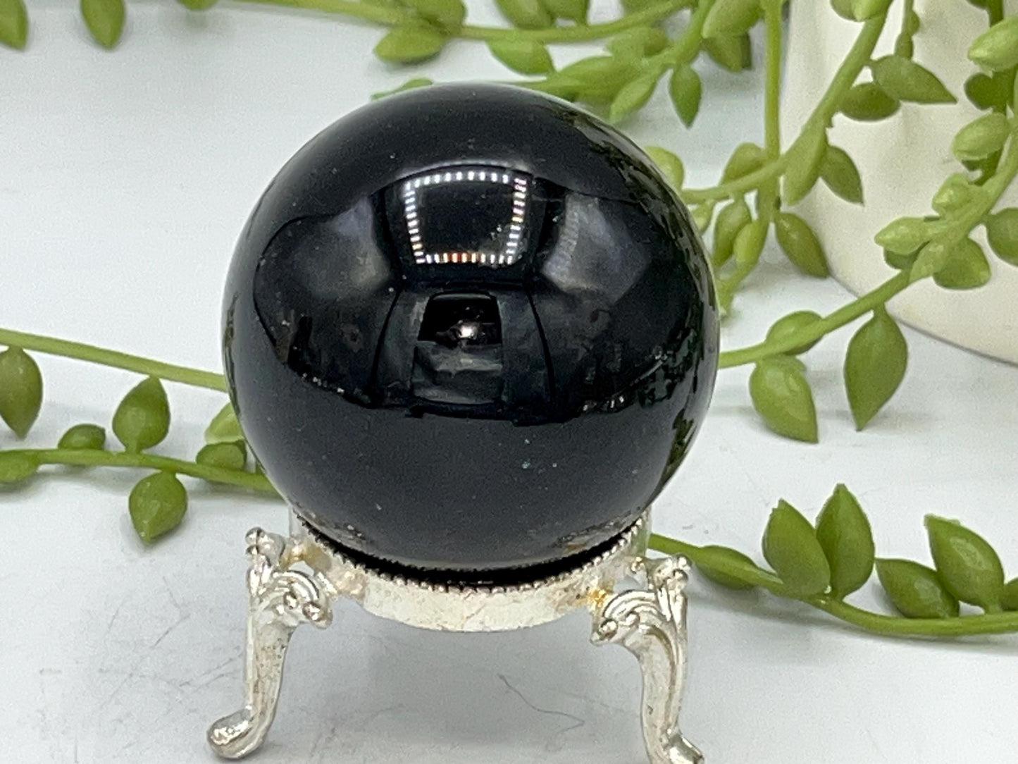 Black obsidian sphere with moon and hands engraved in mint green. crystal spheres, home decor, crystal healing, black Obsidian crystal, gift