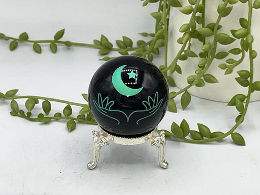 Black obsidian sphere with moon and hands engraved in mint green. crystal spheres, home decor, crystal healing, black Obsidian crystal, gift