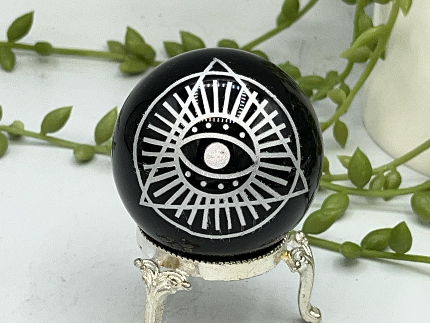 Black Obsidian Sphere with a beautiful Eye of Horus design engraved in silver. Crystal Spheres, home decor, Obsidian Sphere, Birthday Gift