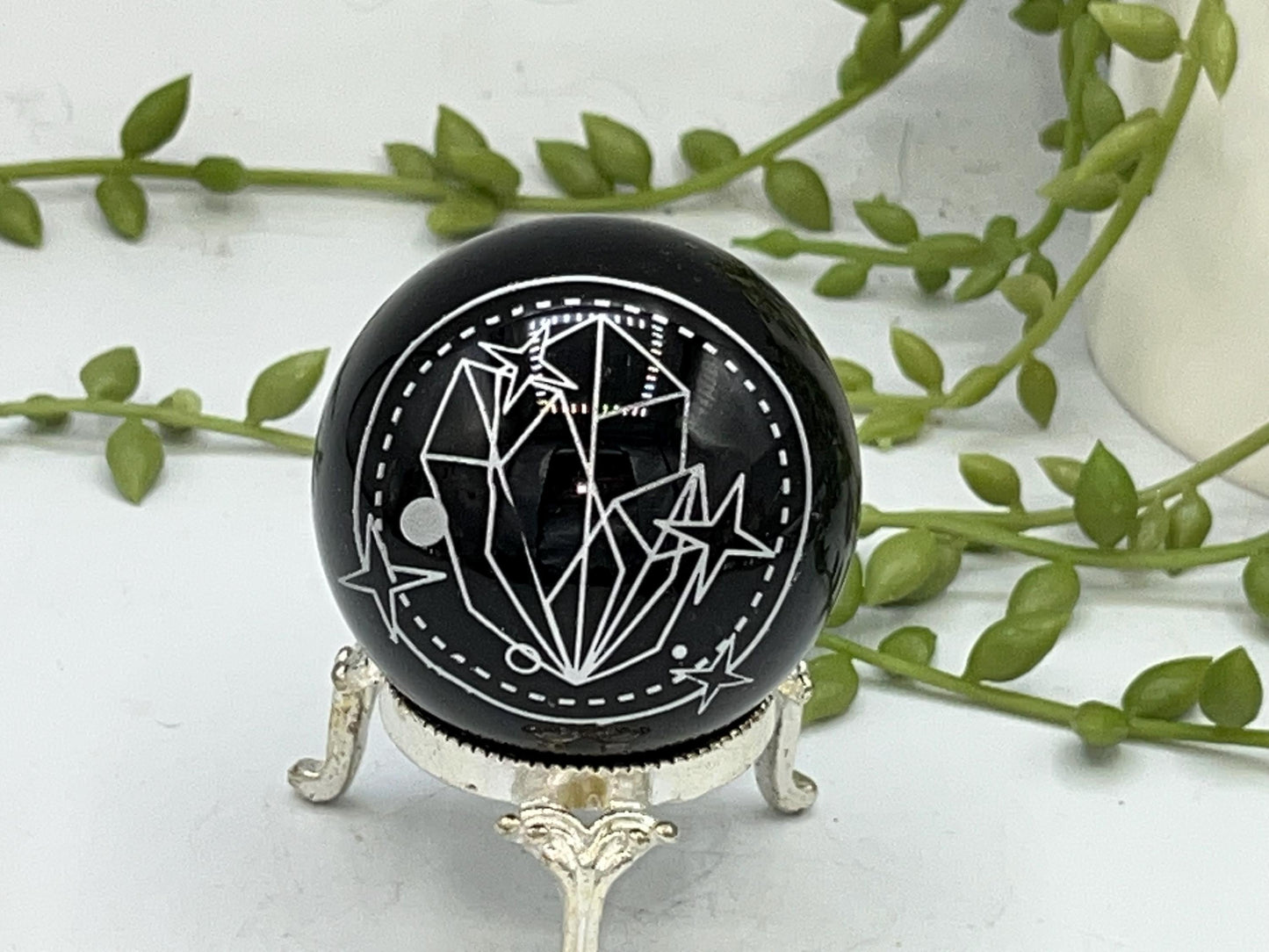 Black Obsidian Sphere with a crystal cluster & star design engraved in silver. Crystal Spheres, home decor, Obsidian Sphere, Birthday Gift