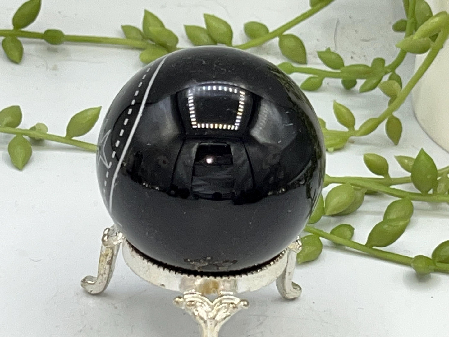 Black Obsidian Sphere with a crystal cluster & star design engraved in silver. Crystal Spheres, home decor, Obsidian Sphere, Birthday Gift