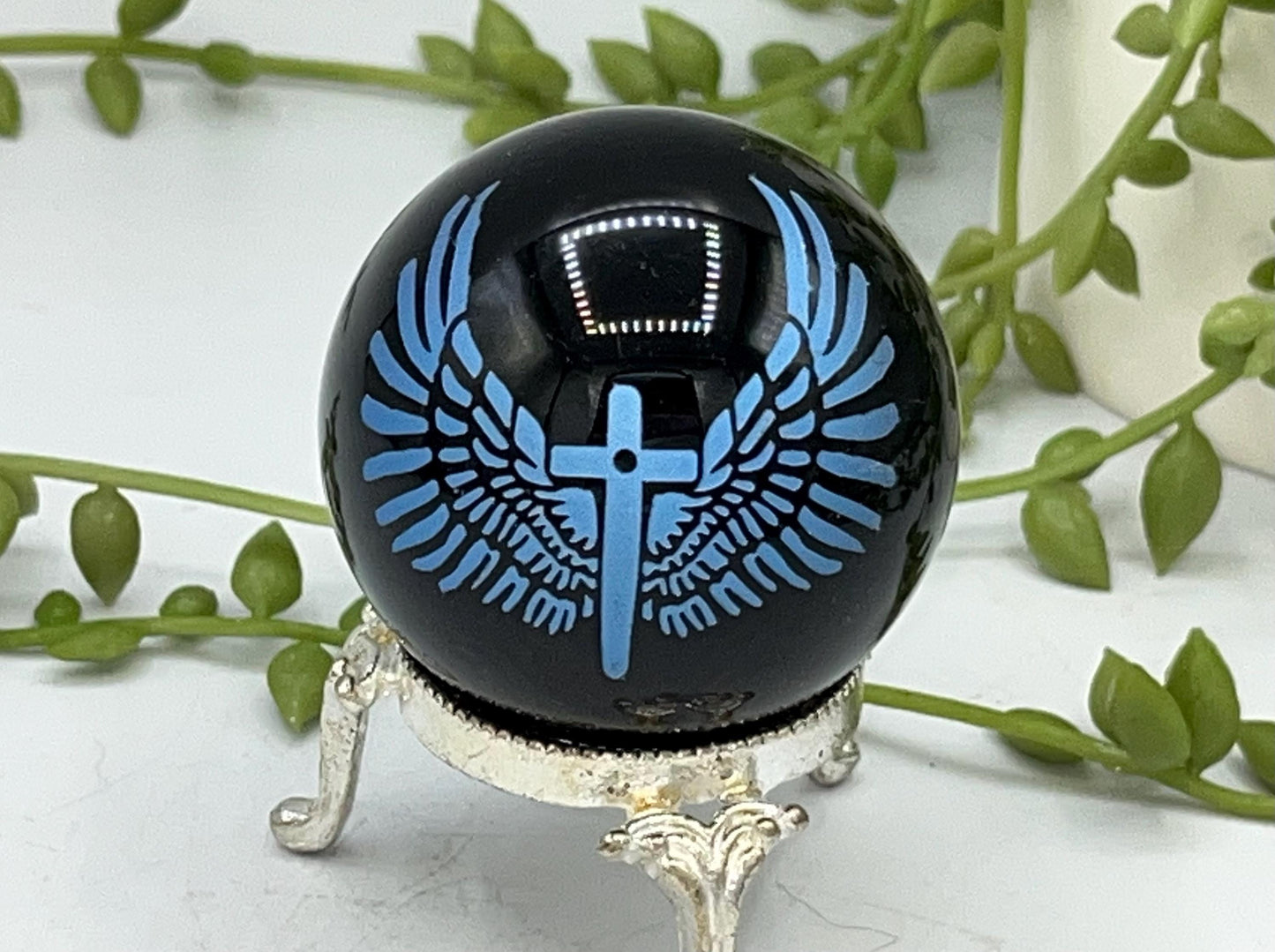 Black obsidian sphere with blue angel wings and crucifix engraving. crystal spheres, home decor, crystal healing, black Obsidian crystals
