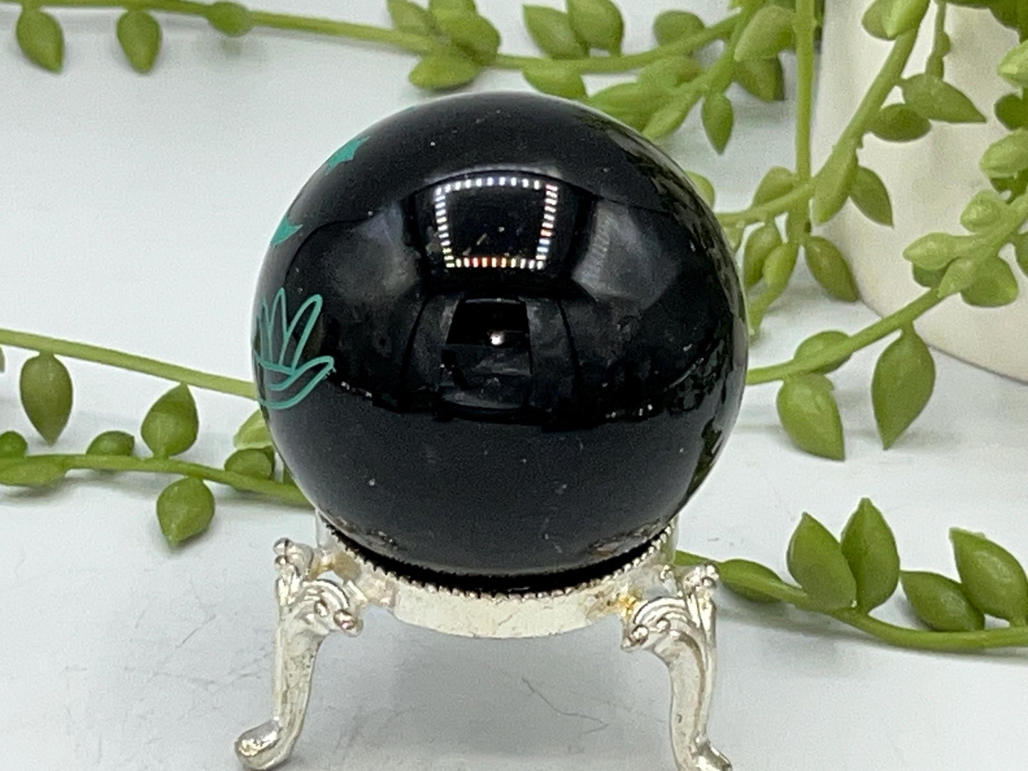 Black obsidian sphere with moon and hands engraved in mint green. crystal spheres, home decor, crystal healing, black Obsidian crystal, gift