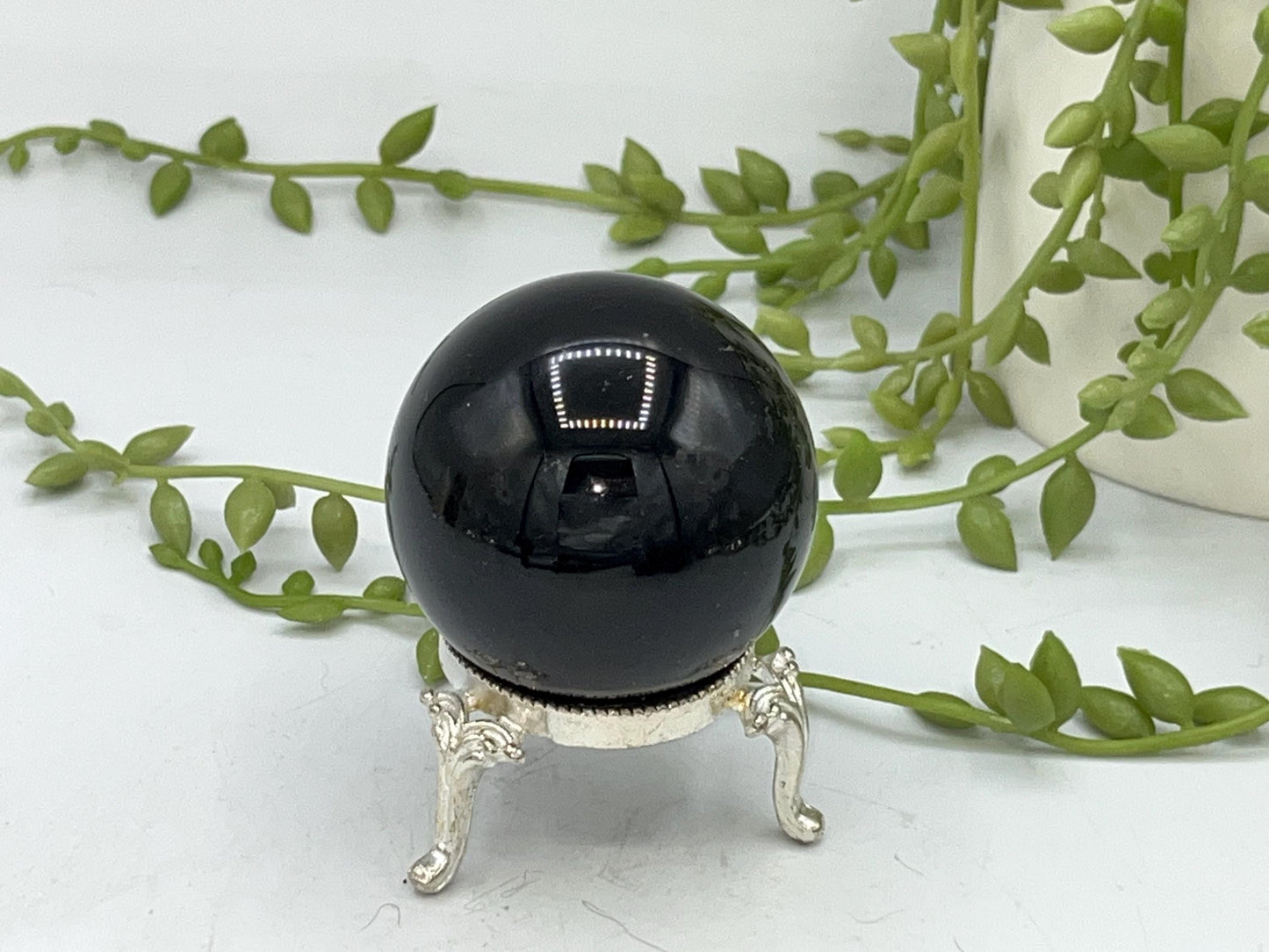 Black obsidian sphere with a beautiful mystical celestial hand pattern with moon phase engraved in silver. crystal spheres, home decor gift