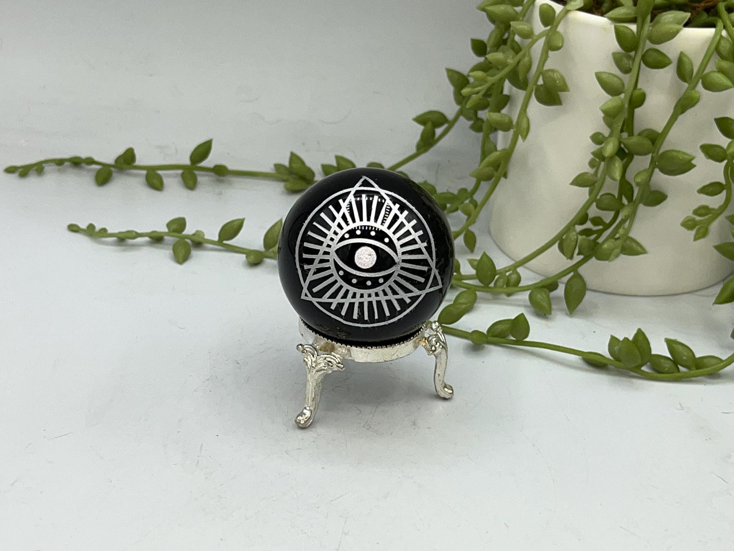 Black Obsidian Sphere with a beautiful Eye of Horus design engraved in silver. Crystal Spheres, home decor, Obsidian Sphere, Birthday Gift