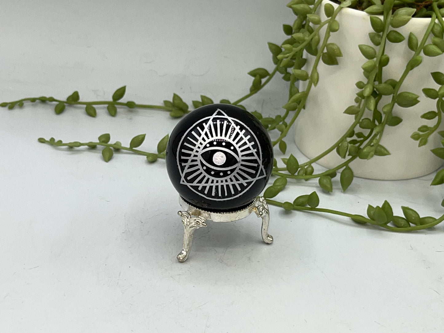 Black Obsidian Sphere with a beautiful Eye of Horus design engraved in silver. Crystal Spheres, home decor, Obsidian Sphere, Birthday Gift