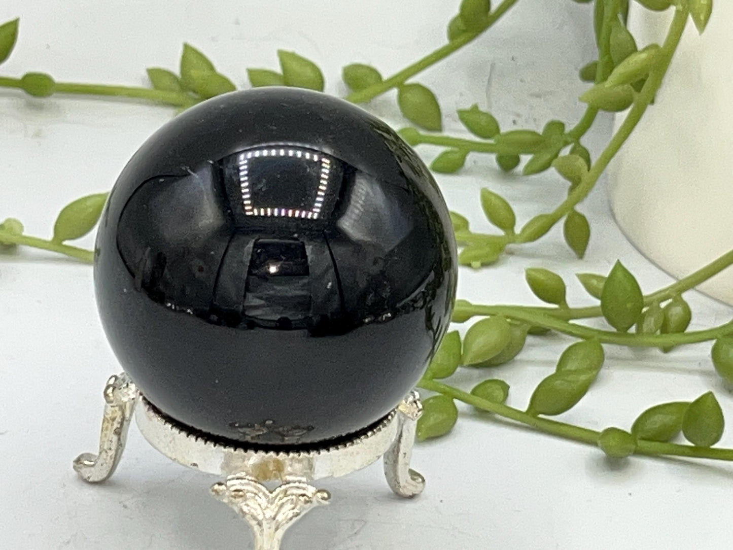 Black Obsidian Sphere with a crystal cluster & star design engraved in silver. Crystal Spheres, home decor, Obsidian Sphere, Birthday Gift